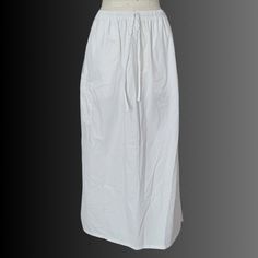 A Maxi Skirt That Is Scrubs For Nurses By The Brand Butter Soft. It Has Elastic Waistband And Drawstring With Deep Side Pockets On The Side Thighs. Size Medium. Full-length Solid Cotton Skirt, Casual Cotton Maxi Skirt For Daywear, Full Length Solid Cotton Skirt, Full Length Solid Color Cotton Skirt, Cotton Maxi Skirt With Elastic Waistband For Daywear, White Cotton Maxi Skirt With Elastic Waistband, Casual White Full-length Skirt, Casual Full Length White Skirt, Casual White Full Length Skirt