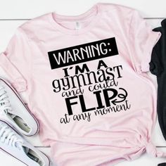 Listing:  (1) Warning I am a Gymnast and could Flip at any moment Shirt.  -Fun and cute way to celebrate being a gymnast! Available in adult and youth sizing. Now Available in Tie Dye Tops!  Main Photo: Pink Shirt 2nd Main Listing Photo:  Pink shirt with black lettering and black shirt with white lettering.  2nd Listing Photo: Tie Dye and white shirts, both with black lettering. Following Listing Photos... Ice Blue, Heather Gray, Pink, Black, Tie Dye, and White Shirts. See more gymnastics items Playful Sports Tops With Letter Print, Fun Sports Graphic Print Tops, Funny Letter Print Gym Tops, Fun Sports Crew Neck Tops, Pink Workout T-shirt With Letter Print, Pink Letter Print Workout T-shirt, Pink Letter Print T-shirt For Workout, Funny Sports Tops With Letter Print, Fun Sports Tops With Letter Print