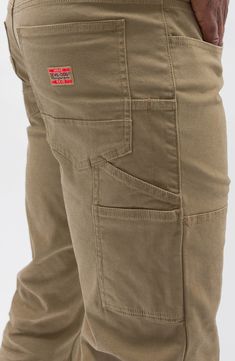 Both durable and soft, these carpenter pants made of breathable cotton sport a touch of stretch and a look that works hard across your casual wardrobe. 16" leg opening; 11" front rise Five-pocket style; tool pockets 98% cotton, 2% spandex Machine wash, tumble dry Imported Mens Pleated Trousers, Khaki Work Pants, Wicked Fashion, Work Pants For Men, Mens Work Pants, Cotton Cargo Pants, Its A Mans World, Work Jeans, Work Gear