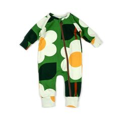 a green and white baby's footie with an orange flower on it