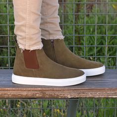 Putting a streetwise spin on a classic boot silhouette, the Chelsea-inspired sneaker provides all the versatility of a Chelsea boot with the mobility and comfort of a pair of sneakers. They feature an elastic + zipper easy pull-on closure style and a sneaker ultra light rubber sole. The Details: Materials: khaki lux suede Lining: brown calf leather Sole: white cupsole rubber sole The Fine Print: Shoe production timeline/shipping Can vary from 30-40 days from the date of order. All shoes are hand Light Sneakers, Custom Design Shoes, Chelsea Boots Men, Classic Boots, Chelsea Boot, Handmade Shoes, Khaki Green, Custom Shoes, Mens Casual Shoes