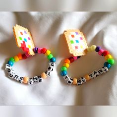 Pop Tarts Rave Kandi Set Of 2 Handmade From Infused Perler Beads. I Hope You Can Enjoy Them As Much As I've Enjoyed Making Them! Interested? Make An Offer Mcr Perler Beads, Single Kandi Ideas, Scene Perler Beads, Rave Perler Ideas, Kandi Belt, Matching Kandi Bracelets, Kandi Patterns Cuff, Kandi Bag, Kandi Bracelets Rave