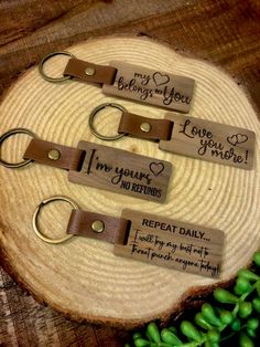 three keychains that say i love you and have two different names on them