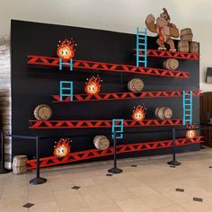 this is a photo of an indoor area that looks like it has been decorated with wood barrels and ladders