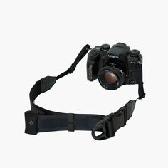 a camera with a strap attached to it