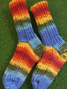 Got smaller feet? These handknit socks could have been made just for you. If you want crazy, bold colors, cart this pair of socks now!  Fits smaller foot, heel to toe length is about 8 inches. Six inch ribbed cuff, never binding. Made on fine needles with a fine yarn. Sock fiber is 75% wool, 25% nylon..easy to wear, easy to care. Machine wash cold, dry flat. Casual Multicolor Knitted Socks, Handmade Casual Socks For Fall, Handmade Multicolor Casual Socks, Cozy Multicolor Knitted Socks, Casual Handmade Multicolor Socks, Casual Multicolor Handmade Socks, Multicolor Cozy Knitted Socks, Cozy Multicolor Hand Knitted Socks, Cozy Multicolor Hand-knitted Socks