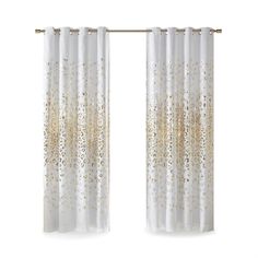 gold and white curtains hanging on a curtain rod