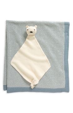 a baby blanket with a teddy bear on it