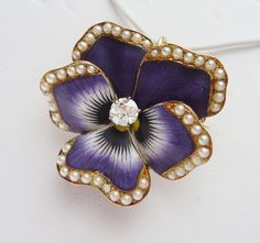 "This is an incredible antique piece from the Art Nouveau period. It is American made in Newark, New Jersey in the early 1900's by Crane & Theurer. This particular pin has been featured in designs by Eliane Fattal for S.J. Phillips in the \"Pensée\" collection. ( http://www.sjphillips.com/media/PhillipsSJphoto/pensee%20prices.pdf ) This collection was also featured in the October Issue of Town & Country Magazine. These pins are rare and incredibly collectible! The piece features a unique Pansy Jewelry, Vampire Novel, Town And Country Magazine, Country Magazine, Newark New Jersey, Pansy Flower, Tri Delta, Pansies Flowers, Pendant Watches