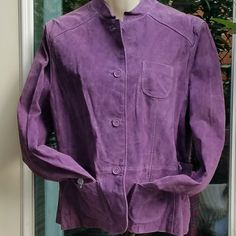 St John's Bay Suede Leather Jacket In A Rosey Lavendar/Purple Long Sleeve Jacket W/Cuffs. Front Tabs 4" W/2 Patch Pockets 4.5" X 4.5". Back Has A Sewn In Belt For The Princess Fit. Completely Lined W/ Inside Buttons Reinforced 4 Outside Buttons (Makes Them Even Stronger) W/Bound Button Holes. Front & Back Yoked. Some Buttons Have The Paper Protectors On Them. Needs To Be Steamed Or Professionally Done Shell 100% Leather Lining 100% Polyester Machine Washable. Non Smoking And Pet Friendly Home Purple Button-up Cotton Outerwear, Purple Button-up Outerwear For Work, Purple Cotton Button-up Outerwear, Spring Purple Outerwear For Work, Purple Button-up Outerwear With Pockets, Purple Buttoned Workwear Outerwear, Purple Buttoned Outerwear For Work, Purple Outerwear With Button Closure For Work, Purple Cotton Outerwear With Button Closure