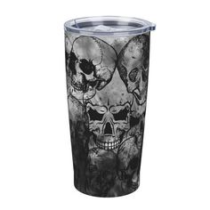 a tumbler cup with skulls on it