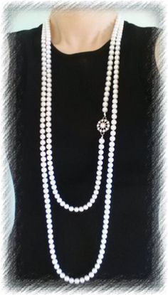 It is Very Stylish, One Strand Necklace of 8mm White Glass Pearls. Especially I used Silver color Seed Bead between Pearls, so it makes you very shiny under the light or sun It is 80 inches with Simple and Fancy Round Flower Pendant. * Pendant Size - 1 inch(H & W) You can make your own style( up to 4~5 strand ) Pearl Necklace. All pieces come Fancy Gift Wrapped and FREE matching Earrings($7.99 Value- made with same color, size Glass Pearl ans Swarovski Clear Crystal). ALL ORDERS ARE SHIPPED Elegant Round Jewelry With 108 Beads, Elegant Long Necklace With 8mm Beads, Classic Beaded Necklaces With 8mm Round Beads, Classic Long Single Strand Beaded Necklace, Elegant Wedding Necklace With 108 Beads, Elegant Formal Beaded Necklaces With 8mm Beads, Natural Necklace, Round Flower, Nature Necklace