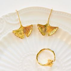 Discover the beauty of autumn with our Golden Ginkgo Leaf Earrings. Crafted with precision and detail, these earrings capture the essence of the season. Made with quality materials, they are a perfect accessory to elevate any outfit. Embrace the changing leaves with these unique earrings. Dimensions: 2.3cm*2.6cm Materials: 18k Gold-plated brass Autumn Earrings, Changing Leaves, Ginkgo Leaf, Fall Earrings, Leaf Earrings, Unique Earrings, Resin Jewelry, The Beauty, 18k Gold