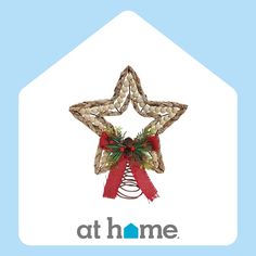 an ornament with a red ribbon and a star hanging from it's side