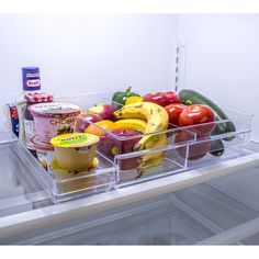 an open refrigerator filled with lots of different types of fruit and veggies in containers