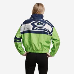 This Seattle Seahawks Women's Winning Play Windbreaker has a bold team logo on the back, so you can show off your team spirit to everyone you leave in the dust while you run the track. Features All-over team-colored design so you can rep the team in style Team logo display on upper left chest, in case there were any doubts where your allegiances lie Bold team logo display on reverse side for an additional dose of awesome Left arm stripes Half-zip structure Long sleeves, so you can fan on even if Logo Display, Seattle Seahawks, Leave In, Team Spirit, Half Zip, Team Logo, Motorcycle Jacket, Seattle, Track