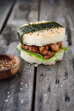 a close up of a sandwich on top of rice