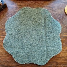 a piece of felt sitting on top of a wooden table