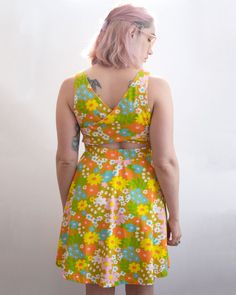 Meet your new summer staple: the sixties floral women's criss cross back summer dress. Transport back to summer in the sixties with this flower power summer dress. Inspired by nostalgic floral sheets, you will be trendy and stay cool in this fun dress. This cool retro dress is made from a soft and stretchy cotton spandex blend and features a criss cross back creating a small opening above the waist for an extra fun detail. 95% Cotton 5% Spandex Criss cross back This print is also available in ba Summer Sundress With Cross-back Design, Retro Dresses With Strawberry Print For Spring, Sleeveless Strawberry Print Summer Dress, Sleeveless Strawberry Print Beach Dress, Floral Sheets, Playful Strawberry Print Summer Dress, Toddler Girl Romper, Fun Dress, The Sixties