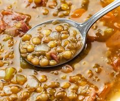 a spoon full of beans and ham soup