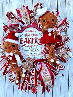 a christmas wreath with two teddy bears and candy canes on it that says, my class baker and all their cookies