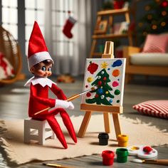 an elf painting on canvas in front of christmas decorations