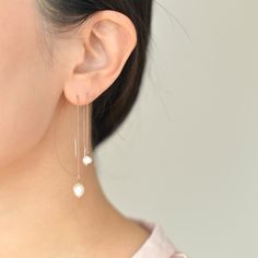 "Dainty Freshwater pearl threader earrings come in two sizes. They are lightweight and easy to put on which makes them suitable for everyday use. They would make the perfect gift idea for bridesmaids on your special day. D E T A I L S - Gorgeous organically shaped freshwater pearls - Lightweight and effortless. Suitable for everyday use - Easy to put on through wire bar ends - A freshwater pearl hanging from a delicate nickel-free chain - Each pearl is unique and irregular in shape by nature and Minimalist Pearl Threader Earrings As Gift, Rose Gold Dangle Pearl Earrings, Minimalist Threader Earrings For Wedding, Delicate Wedding Threader Earrings, Minimalist Threader Earrings With Ear Wire For Wedding, White Pearl Threader Earrings With Charm, Minimalist Wedding Threader Earrings With Ear Wire, Minimalist Drop Threader Earrings For Wedding, Pearl Threader Drop Earrings With Pearl Charm