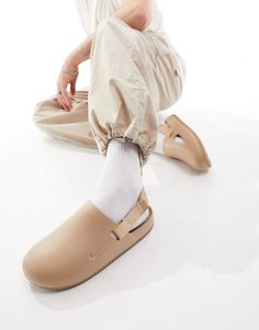 Sneakers by Nike These shoes + you = solemates Slingback strap Slip-on style Round toe Chunky sole Casual Slingback Mules With Rubber Sole, Nike Mules Outfit, Beige Non-slip Round Toe Clogs, Casual Beige Flat Heel Mules, Casual Non-slip Beige Clogs, Casual Beige Non-slip Clogs, Casual Beige Closed Toe Mules, Casual Beige Clogs With Rubber Sole, Casual Beige Slip-on Mules