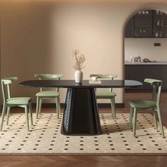 a dining table with four chairs and a vase on top of it in a room