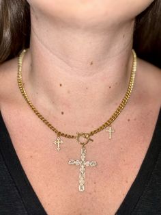 Gold chain necklace with a three cross charms of varied sizes spaced evenly near the middle. Gold filled and tarnish resistant. Cross Pendant Chain Necklace, Adjustable Chain Cross Pendant Necklace, Gold Metal Cross Charm Necklaces, Cross Pendant Charm Necklace With Adjustable Chain, Cross Pendant Charm Necklace, Metal Cross Charm Necklace With Clavicle Chain, Metal Cross Necklace With Chain Pendant, Metal Cross Pendant Necklace With Chain, Metal Cross Necklace With Chain