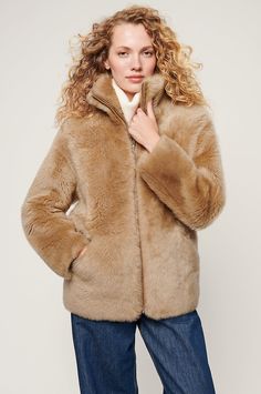 Make a statement in the fabulously stylish, wonderfully warm, and timelessly luxurious Adriana jacket. It's made from genuine Spanish Merinillo shearling with a lustrous texture and natural insulation, keeping you cozy from the earliest hint of winter to the last vestiges of spring. A standup collar gives edge to this zip-front coat, while two slip pockets offer space for chilly hands or small essentials. Luxury Mink Outerwear With Faux Fur Trim, Luxury Mink Outerwear With Faux Fur Lining, Elegant Shearling Outerwear In Mink Color, Luxury Faux Fur Outerwear In Mink Color, Elegant Mink Shearling Outerwear, Elegant Mink Colored Shearling Outerwear, Luxury Sheepskin Outerwear In Mink Color, Sheepskin Outerwear In Mink Color For Cold Weather, Fall Sheepskin Outerwear In Mink Color