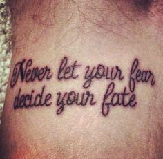 a tattoo saying never let your fear decide your fate