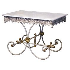 a white table with gold accents on it