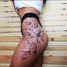 a woman's thigh with flowers on it