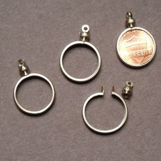 Coin Holder Bezel Penny USA 1 cent Silvertone for charm, necklace, pendant Pk/4 Nickel Free Round Metal Pendant Charms, Nickel-free Metal Round Pendant Charms, Nickel-free Round Metal Pendant Charm, Nickel Free Adjustable Round Pendant Charms, Adjustable Nickel-free Round Pendant Charms, Gift Jewelry With Jump Ring Dangles, Nickel-free Round Pendant For Jewelry Making, Metal Coin-shaped Jewelry With Charms, Nickel Free Round Metal Charms