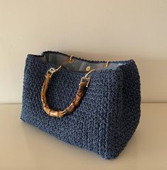 Blue Top Handle Straw Bag For Travel, Blue Top Handle Straw Bag For Everyday Use, Straw Bag With Rolled Handles For Shopping, Casual Crochet Bag With Bamboo Handle, Casual Crochet Top Handle Bag With Bamboo, Casual Crochet Top Handle Bag With Bamboo Handle, Blue Top Handle Straw Bag For Shopping, Top Handle Beach Bag With Bamboo Handle For Shopping, Rectangular Blue Straw Bag