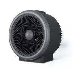 a black fan sitting on top of a white table next to a gray and black object