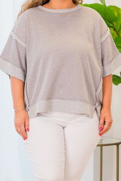 The Avoidant Top in sleet offers a versatile high-low hem and stylish contrast trim! Its drop shoulder design allows for comfortable wear, whether dressing up or down with denim or leggings! Elevate your wardrobe with this must-have piece! 46% Polyester, 39% Cotton, 15% Rayon Fall Striped Hem Top For Loungewear, Oversized Top With Striped Hem, Oversized Spring Top With Striped Hem, Crew Neck Tops With Striped Hem For Layering, Spring Oversized Top With Striped Hem, Oversized Tops With Striped Hem For Spring, Oversized Striped Hem Tops For Spring, Crew Neck Tops With Striped Hem, Spring Striped Hem Loungewear Top