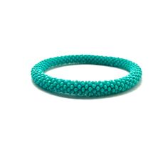 a turquoise beaded bracelet on a white background