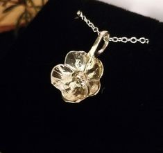 A beautiful Buttercup flower reminiscent of springtime!.   It is handcrafted from 935 argentium Silver  Size 1 x 1 cm    All my jewellery is entirely handcrafted to order and therefore everyone of them is unique in its own right. If for friends or family or as a present to yourself.  Each piece I make is made with love for the craft and nature to ensure that it is the perfect quality gift.  All my pendants come with a free 20 inch chain and come in a high quality black leatherette presentation Buttercup Flower, Argentium Silver, The Craft, Pendant Necklaces, Halloween Shopping, My Jewellery, Jewelry Necklace Pendant, Butter, Accessory Gift