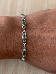 Lovely faceted peridot and sterling silver bracelet. The bracelet has 10 individual faceted peridot stones in marquise shape.  The bracelet measure 19.5 cm long and it is almost 0.5 cm wide. The bracelet can be  easily  adjusted from 19.5 cm to 18.5 cm.  The high quality of our stones is what it makes this bracelet so precious. The peridot is faceted to add the extra shining and elegance to the bracelet.  A perfect present for her on any occasion St Valentine Day, Birthday, Anniversary, or Chris Fantasy Earrings, St Valentine, Peridot Bracelet, Dope Jewelry, August Birthstone, Bracelet Chain, Jewelry Lookbook, Funky Jewelry, Mens Accessories Jewelry