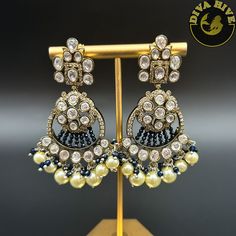 Premium Moissanite Earring with high qualtiy beads and hanging Pearl Nickel Free Metal : Brass Perfect for all big occasion Designer wear Handcrafted Note: Don't Put Perfume on the Earring Elegant Chandbali Earrings With Dangling Beads, Elegant Chandbali Beaded Earrings With Dangling Beads, Party Pearl Drop Jhumkas, Party Jhumkas With Pearl Drop, Round Earrings With Dangling Beads For Celebrations, Statement Chandeliers, Moissanite Earrings, Gold Polish, Designer Wear