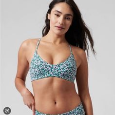 Athleta Triangle Bikini Top Size: Small D-Dd Color: Flora Camo Green/ Purple New With Tag! For: Swim, Surf, Stand-Up Paddleboard, And All Water Sports Feel: Recycled H2eco Swim Fabric Is Smooth And Sleek With Powerful Stretch Fave: Adjustable Back Detail Allows You To Customize Your Fit Removable Cups Dry Quickly And Maintain Their Shape Over Time Sports Tankini With Built-in Bra And Triangle Top, Purple Sports Bra For Summer, Purple Sports Bra With Built-in Bra For Summer, Workout Tankini With Built-in Bra, Casual Workout Tankini, Poolside Athleisure Triangle Top Sports Bra, Athleisure Triangle Top Sports Bra For Poolside, Medium Support Swimwear For Summer Swimming, Sports Tankini With Built-in Bra