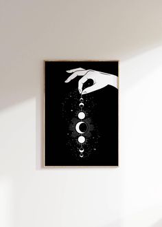 a black and white poster hanging on the wall