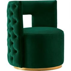 a green velvet chair with gold accents