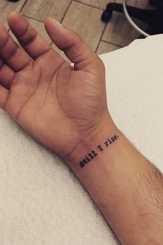 Tattoo that reads, ‘still
i rise.’ Rise Tattoo Ideas, Still I Rise Tattoo Ideas, Tattoo Ideas Wrist, I Rise Tattoo, Still I Rise Tattoo, Rise Tattoo, Resilience Tattoo, Meaningful Tattoos For Men, Tattoo Quotes For Men