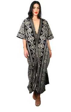 Our "Majestic V neck Kaftan" is exactly that - MAJESTIC! This kaftan is made out of a thicker Black velvet with a gold and white embroidered pattern on it. The kaftan has a front V neckline and is fully lined. The kaftan has 3 slits total, 2 side's and one in the center front. This kaftan will only be made in a few limited items and is a true show stopper. The kaftan feels very Regal Moroccan & perfect for the Holiday Party season or a Fancy destination. This item is made to order in Los Angeles V Neck Kaftan, Sunday Monday Tuesday, Monday Tuesday Wednesday, V Neckline, Holiday Party, Black Velvet, Holiday Parties, Angeles, Velvet