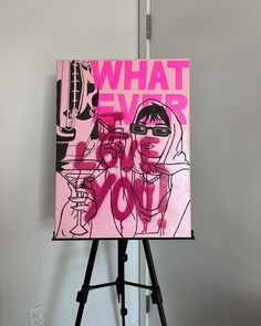 a pink poster with the words what ever do you? on it next to a tripod