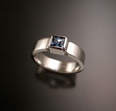 "5 mm square scissors-cut blue Topaz is bezel set with stout 2mm thick by 5mm wide rectangular band. These are beautifully cut, eye clean stones with top sky blue color. I can make this ring for you in any size between 5 and 11. Pictured ring is size 7 for scale. Specify your ring size in a \"note to seller\" at checkout." Blue Topaz Ring Sterling Silver, Sky Blue Color, London Blue Topaz Ring, Square Stone, Blue Topaz Ring, London Blue Topaz, Topaz Ring, Ring Sterling Silver, Sterling Ring