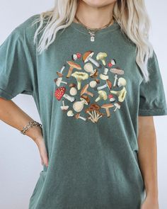 Looking for a unique and stylish gift? Look no further than our Comfort Colors Mushroom Shirt! This shirt features a vibrant mushroom design on the front. It's perfect for anyone who loves mushrooms, or just wants to show their love for nature in a fun and fashionable way. Whether you're giving it as a gift to your friend who loves mushrooms, or you're looking for something special to wear yourself, the Mushroom Shirt is sure to please. Comes in multiple colors! ✨️SIZE AND FIT: Your shirt will b Casual Mushroom Print T-shirt For Spring, Cotton T-shirt With Mushroom Print, Crew Neck, Cotton Crew Neck T-shirt With Mushroom Print, Relaxed Fit Fall Tops With Mushroom Print, Spring Cotton Tops With Mushroom Print, Relaxed Fit Top With Mushroom Print For Fall, Relaxed Fit Mushroom Print Top For Fall, Spring Cotton Top With Mushroom Print, Cotton Short Sleeve Shirt With Mushroom Design